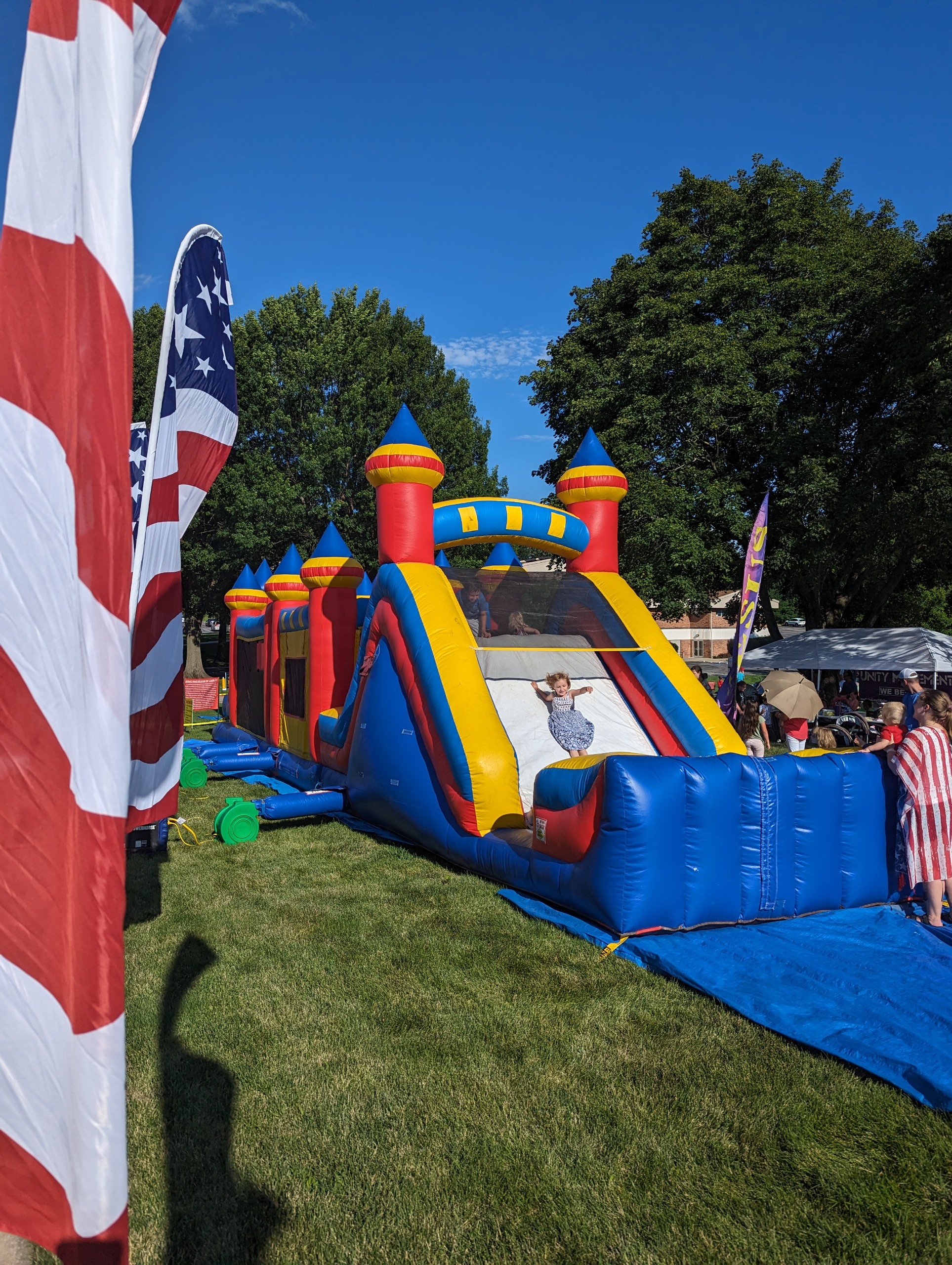 Children playing on an inflatable obstacle course