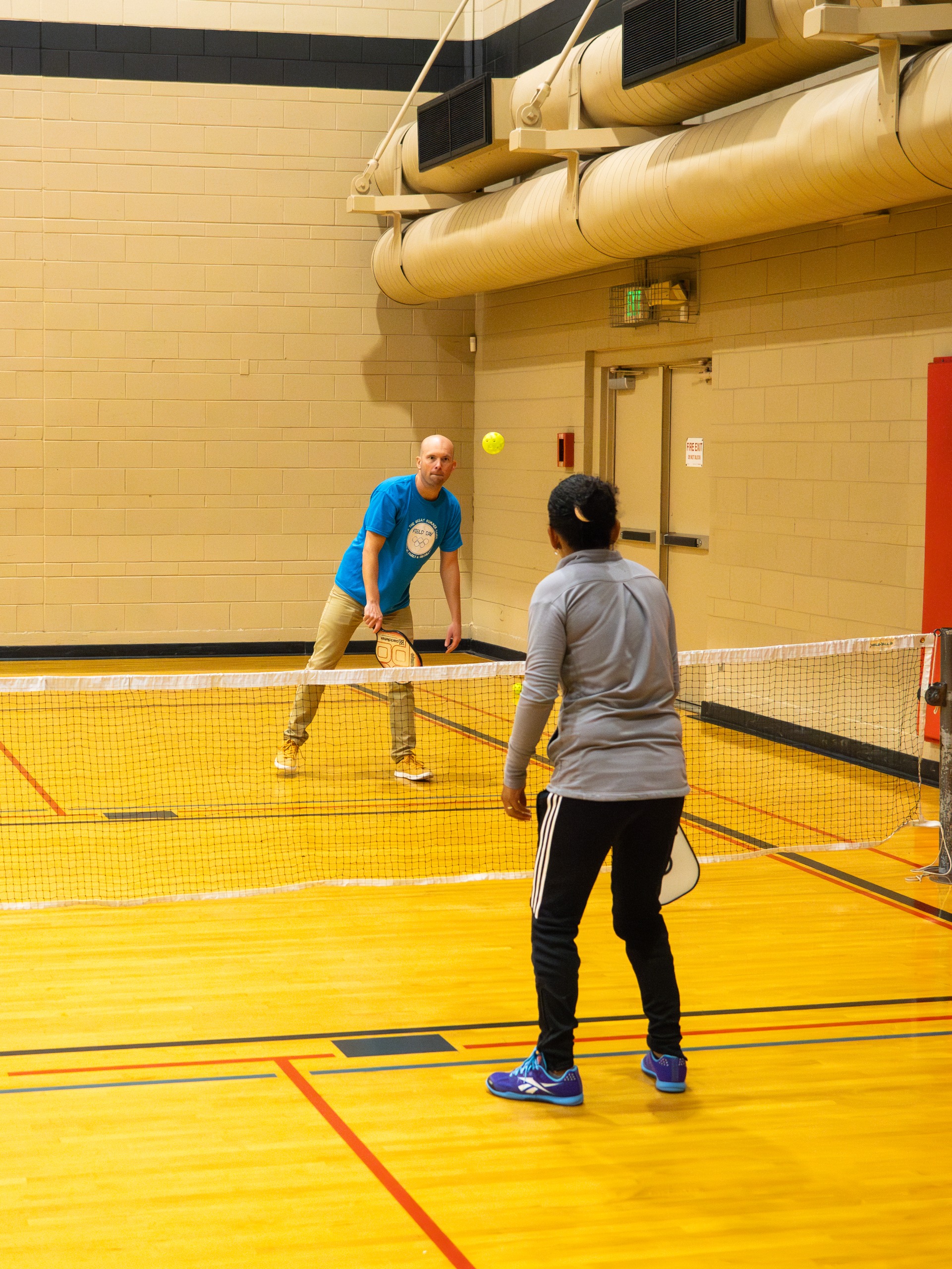 People playing pickleball.